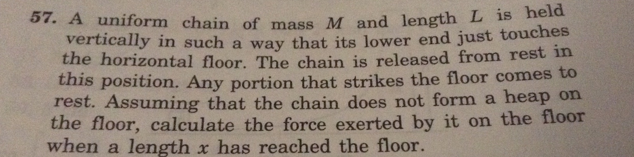 a uniform chain of mass m and length l is held vertically in such a w ...