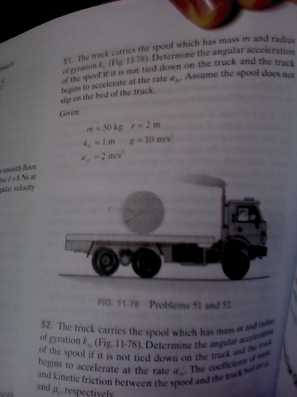 Question image for How to find angular acceleration for the spooltryi